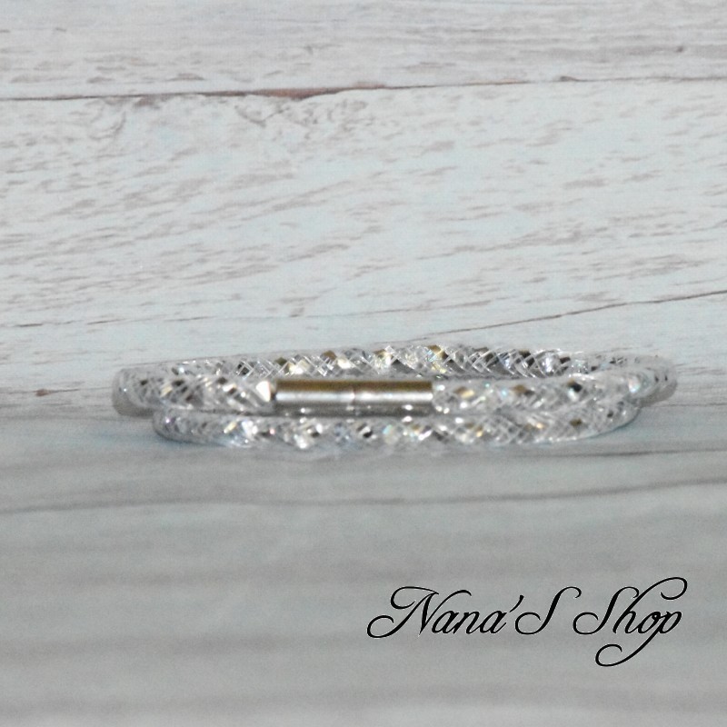Collier ou bracelet double, tube résille, effet stardust, coloris argent. Collier ou bracelet double, tube résille, effet stardust, coloris argent.