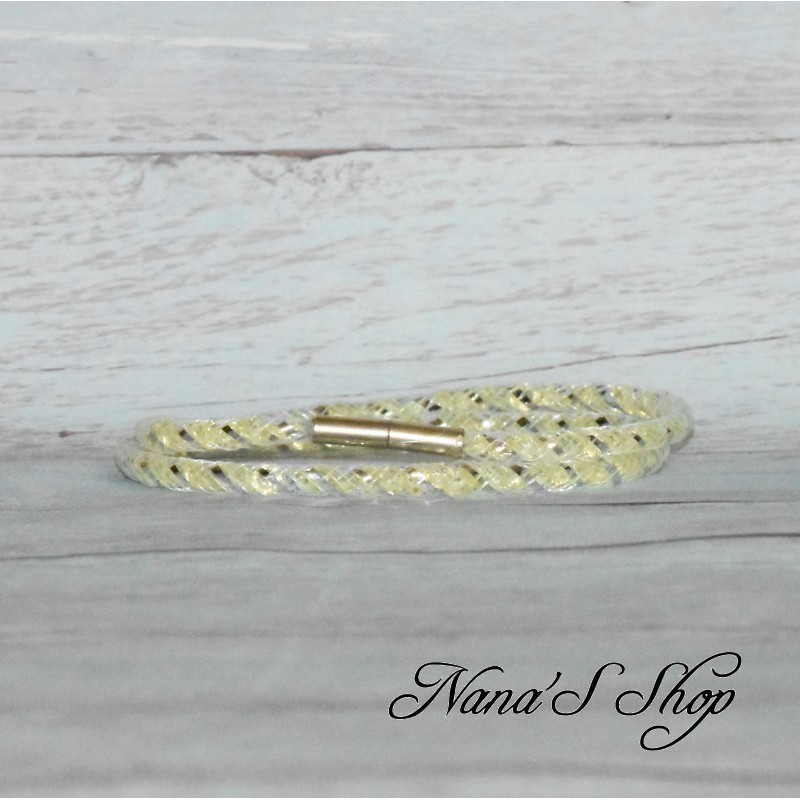 Collier ou bracelet double, tube résille et strass, effet Stardust, coloris jaune. Collier ou bracelet double, tube résille et strass, effet Stardust, coloris jaune.