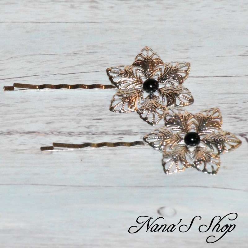 Barrettes fine en métal, fleur, coloris noir. Barrettes fine en métal, fleur, coloris noir.