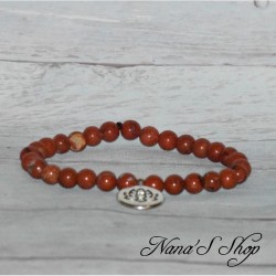 Bracelet élastique en perles naturelle de Jaspe rouge et pendentif médaillon Fleur de Lotus.