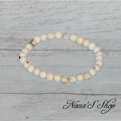 Bracelet perles ronde, en Magnésite, nuances de blanc et quelques nuance de noir et marron.