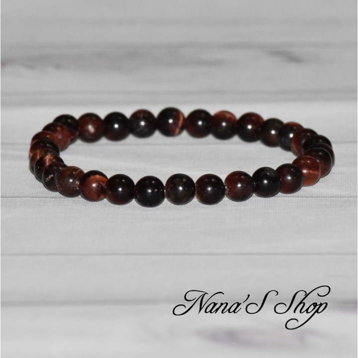 Bracelet fait main, en œil de taureau, dans les tons rouge marron foncé.