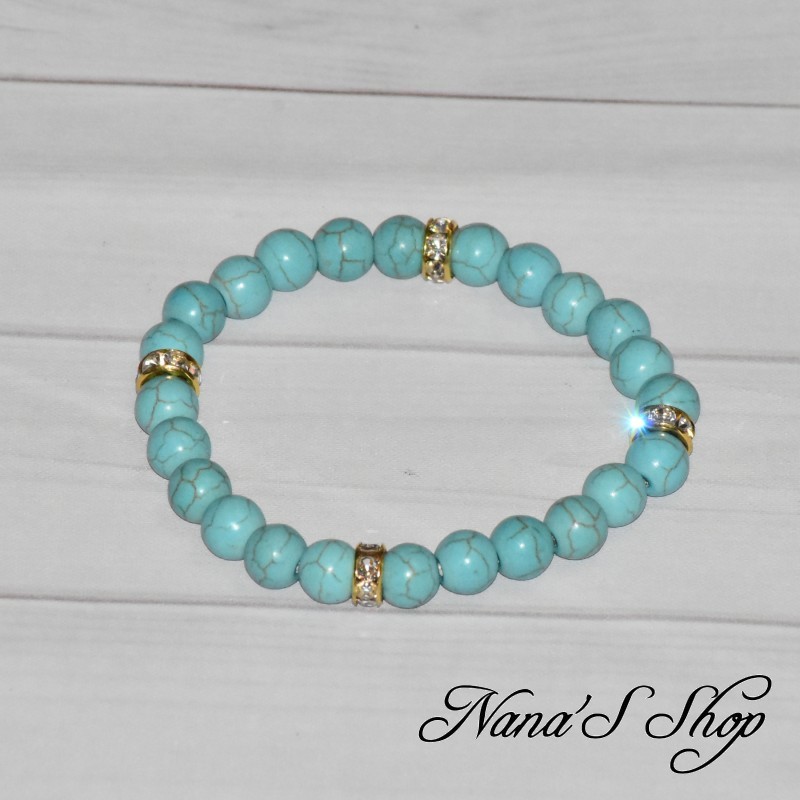 Bracelet élastique en perles bleu turquoise, en Howlite marbré et intercalaires strass dorée.