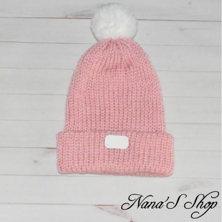Bonnet fille, tricoté mains, à revers et doublé, de couleur rose pâle uni, pompon et détail blanc