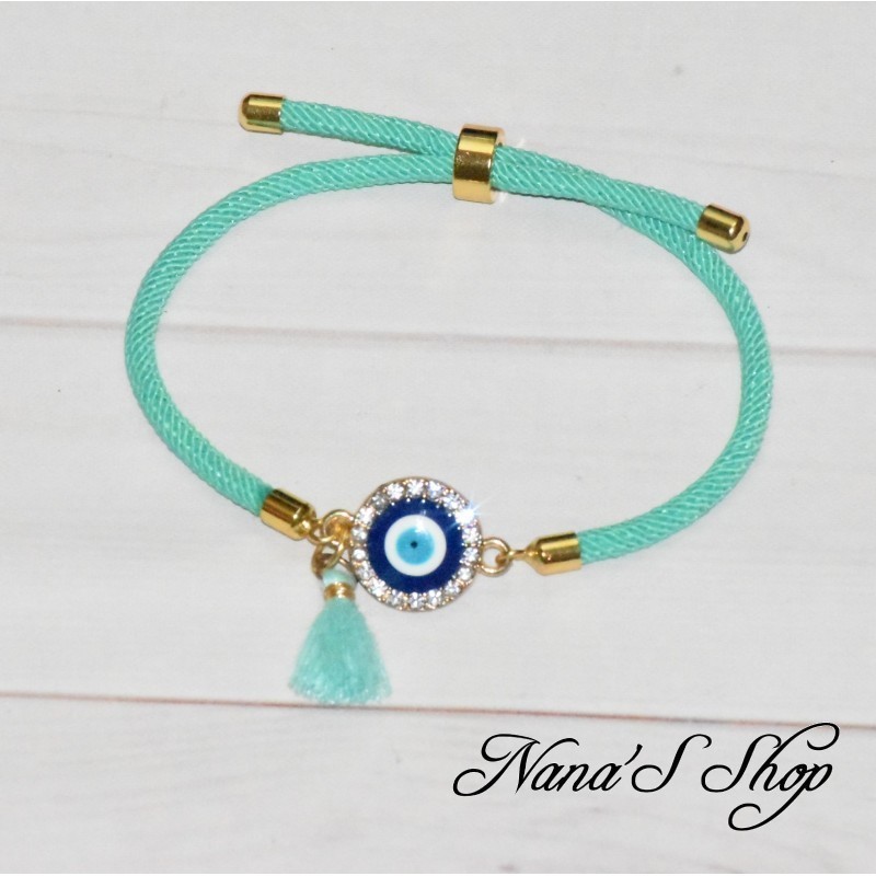 Bracelet coulissant, 3ème œil et pompon Tassel, coloris menthe. Bracelet coulissant, 3ème œil et pompon Tassel, coloris menthe.