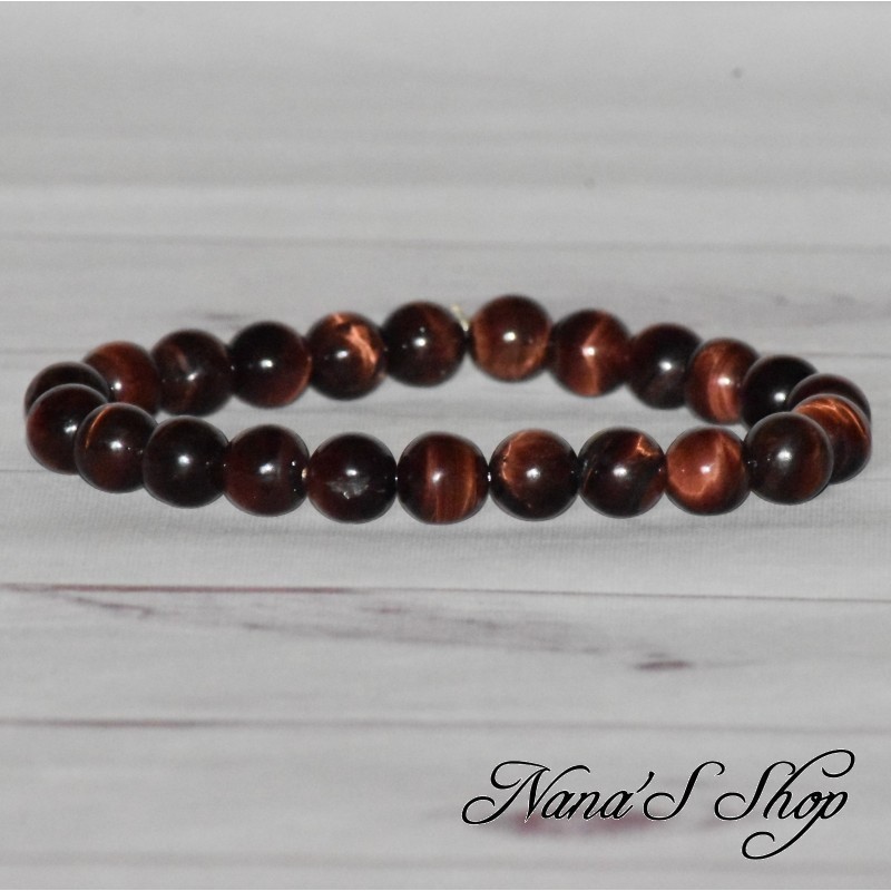 Bracelet fait main, en œil de taureau, dans les tons rouge marron foncé.