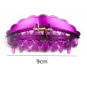 Pince crabe XL 9 cm de plastique transparent, coloris mauve.