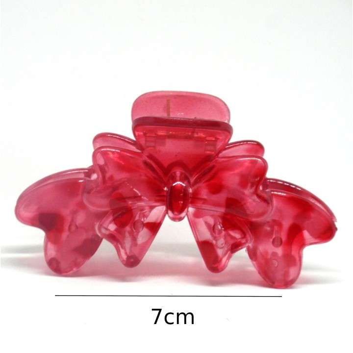 Pince crabe transparente, forme nœud, coloris rouge.