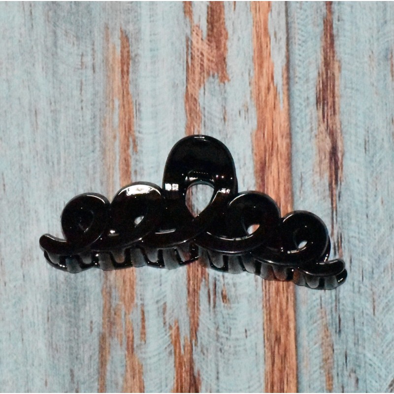 Pince à cheveux, forme boucles, en plastique, coloris noir opaque. Pince à cheveux, forme boucles, en plastique, coloris noir opaque.