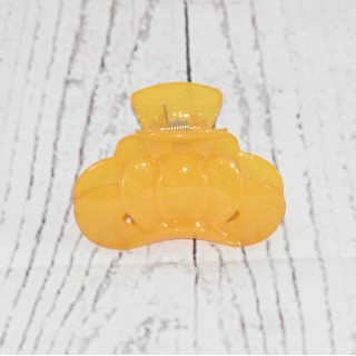Pince crabe à cheveux, de couleur opaque, coloris jaune.