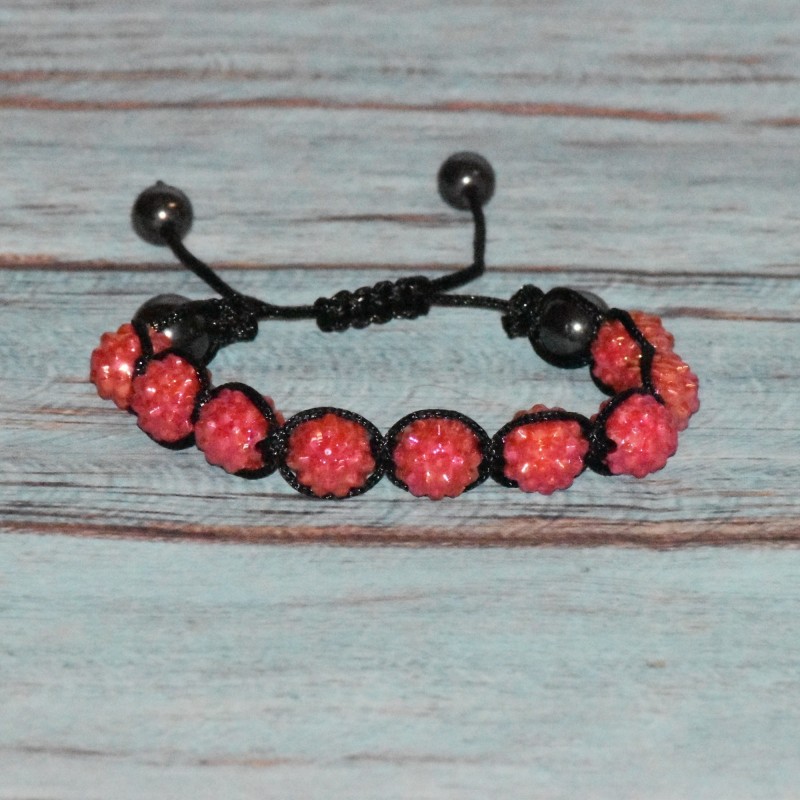 Bracelet "sugarchambas ennéade" coloris corail.