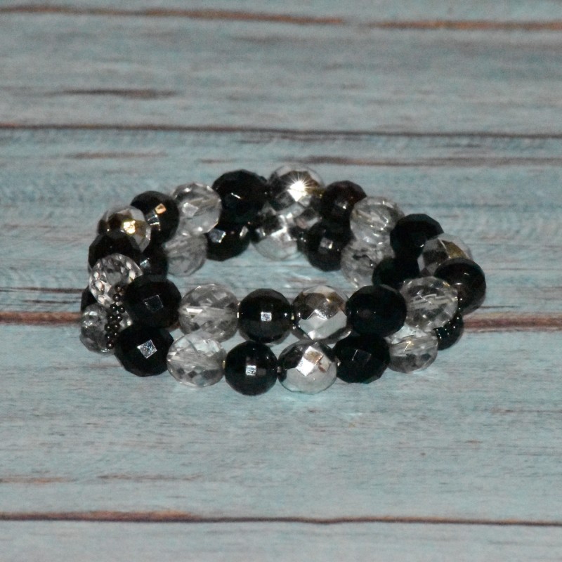 Bracelet perles facettés en plastique, double rang, coloris noir et transparent.