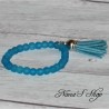 Bracelet fantaisie, perles en verre dépoli et tassel, coloris bleu.